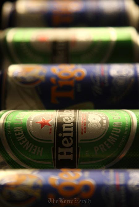 Heineken lấy tiền... đè đối thủ để thâu tóm Tiger